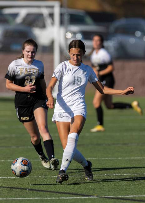 Arbor View’s Bridget Guevara (19) passes the ball past Faith Lutheran’s Christina ...