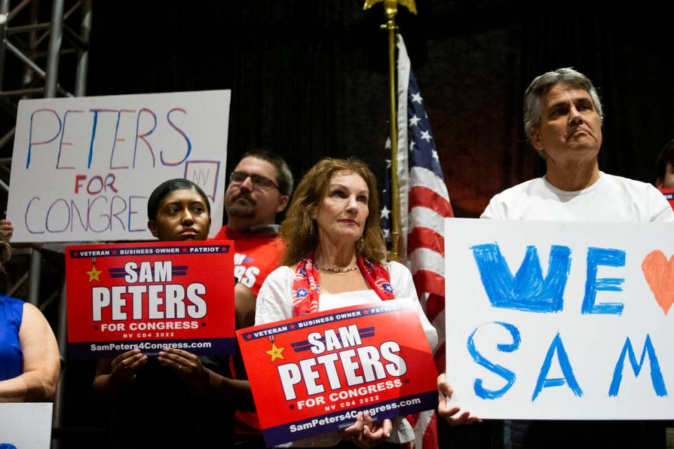 Attendees of the "Fight for Freedom" Campaign Kickoff event listen to Republican Sam Peters spe ...