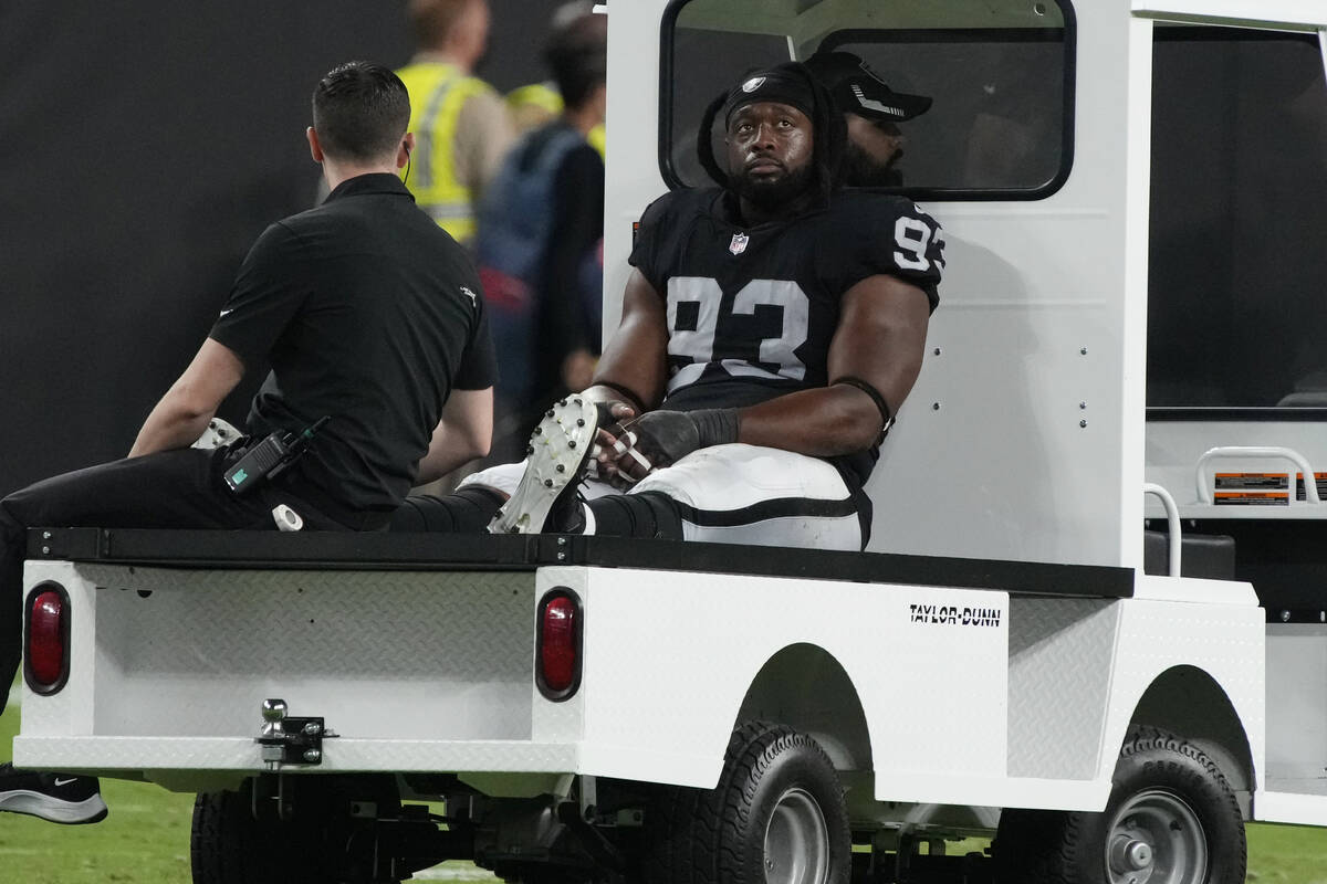 Las Vegas Raiders defensive tackle Gerald McCoy (93) is taken off the field during the second h ...