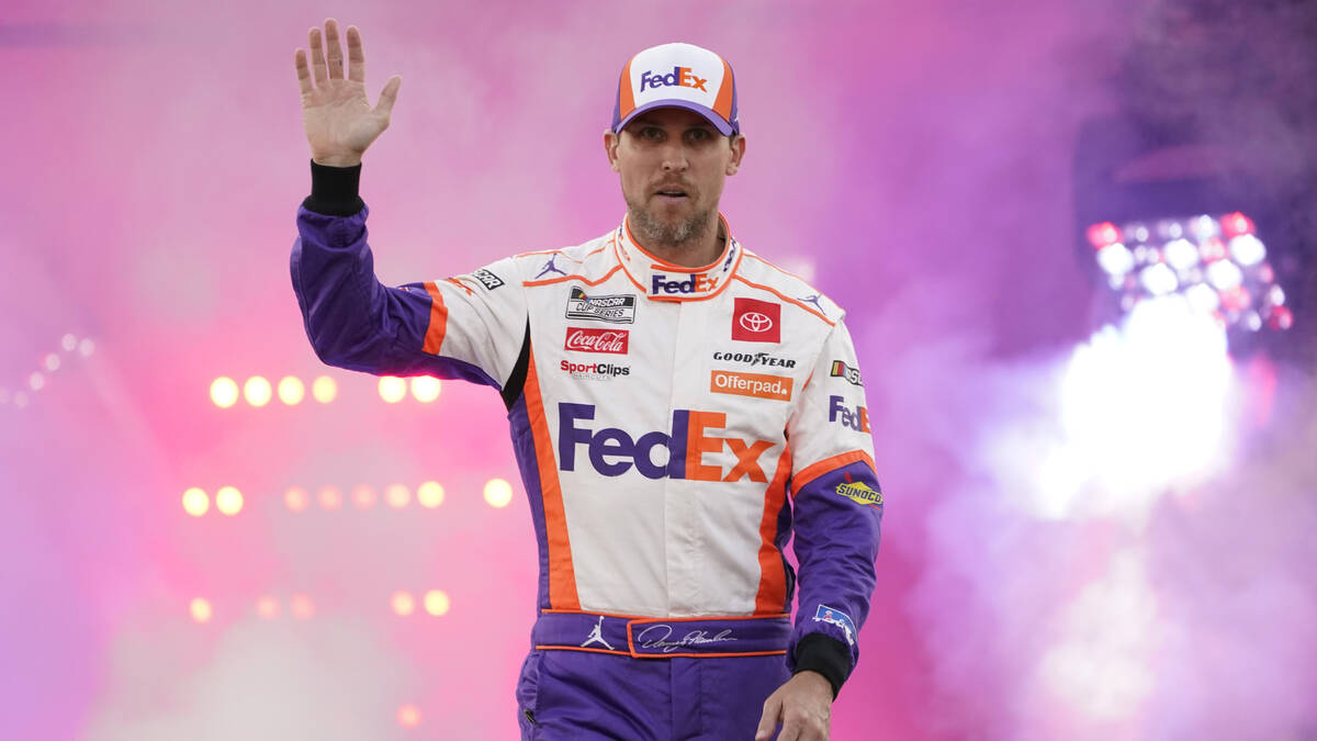 Denny Hamlin waves to the crowd during driver introductions prior to the start of the NASCAR Cu ...