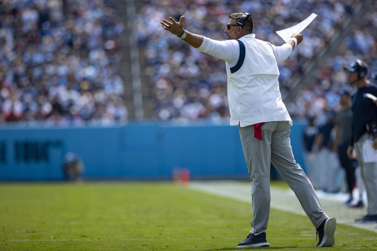 Tennessee Titans head coach Mike Vrabel gestures toward referees during the first half of an NF ...