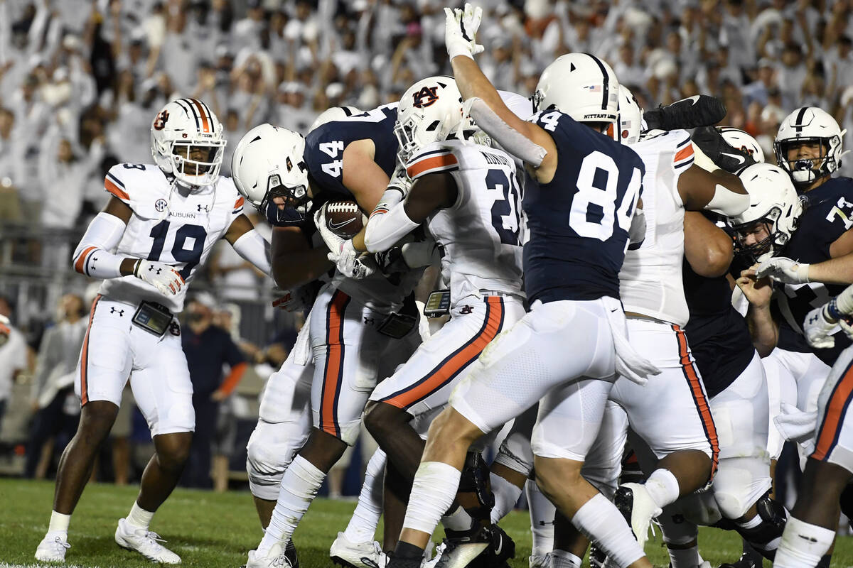 Penn State's Tyler Warren (44) dives into the end zone to score during the second half of an NC ...