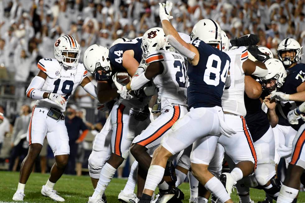 Penn State's Tyler Warren (44) dives into the end zone to score during the second half of an NC ...