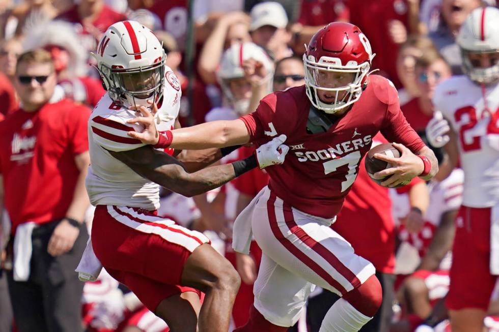 Oklahoma quarterback Spencer Rattler (7) grabs the face mask of Nebraska cornerback Quinton New ...