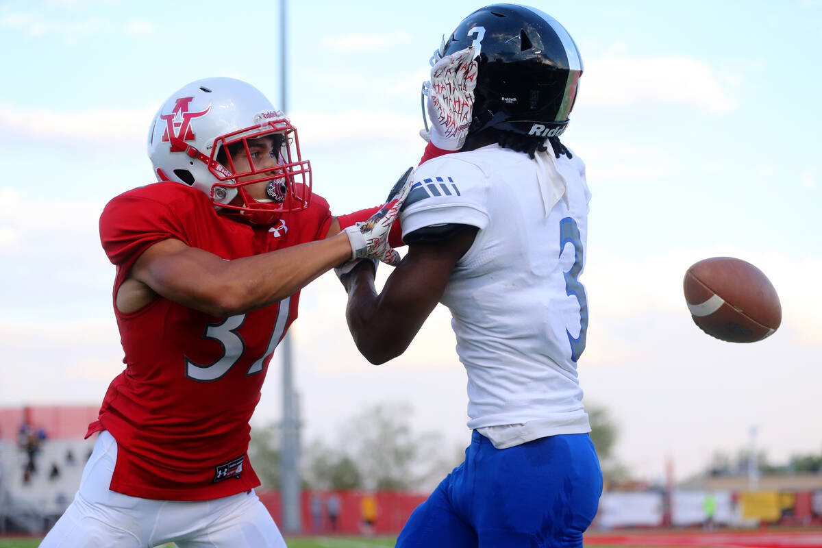 Arbor View's Jason Sermons (37) breaks up a pass intended for Desert Pines Lavon Brown (3) in t ...