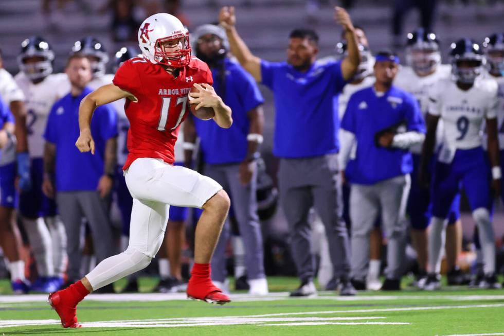 Arbor View's Kyle Holmes (17) runs the ball in the first half of a football game against Desert ...