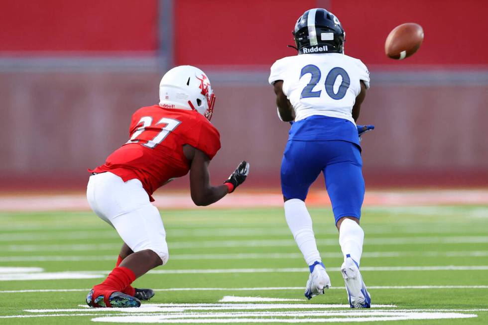 Desert Pines Isaiah Rubin (20) intercepts a ball intended for Arbor View's Makhai Donaldson (27 ...