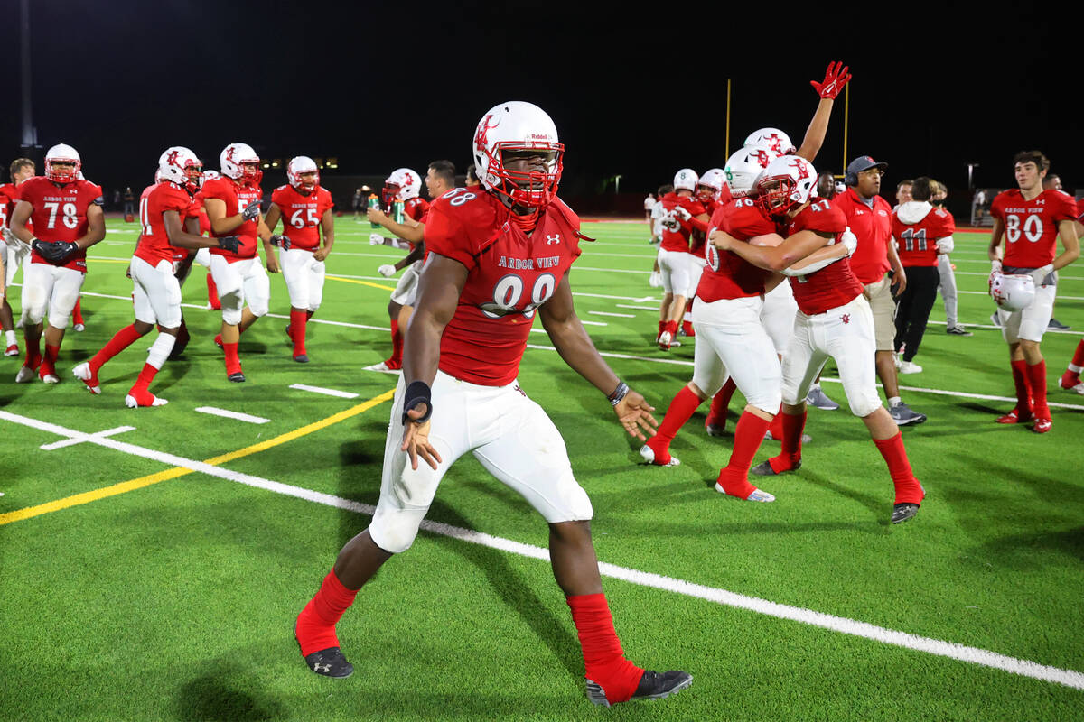 Arbor View's Zurich Ashford (88) celebrates his team's win over Desert Pines 22-21 in a footbal ...
