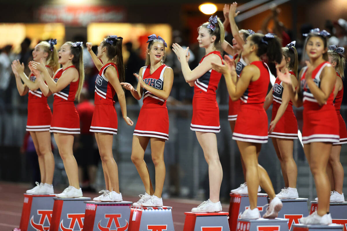 Cheerleaders watch from the sideline during the second half of a football game between Arbor Vi ...