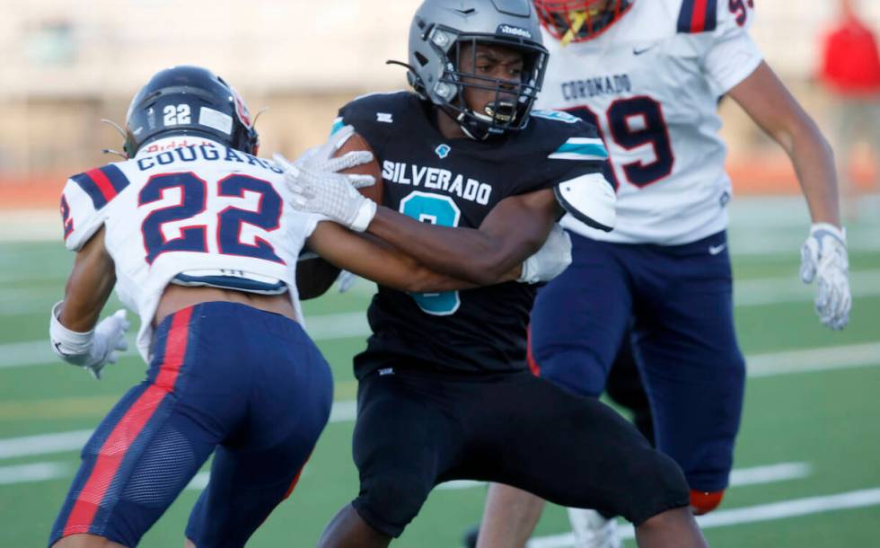 Silverado High School's John Agounke (6) plays against Coronado High School's Jeremiah Kunitake ...