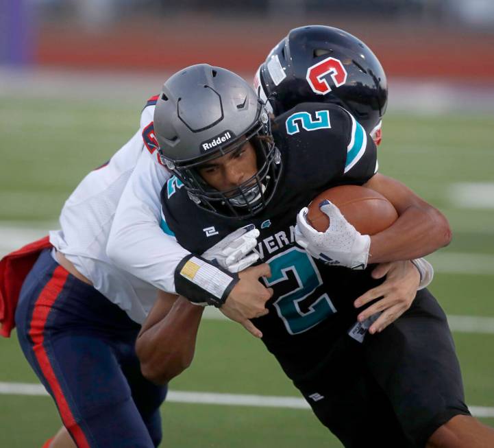 Silverado High School's Donavyn Pellot (2) is tackled by Coronado High School's Logan Cheney ( ...