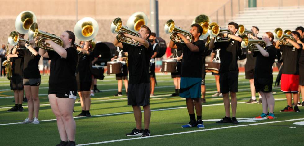 Silverado High School marching band perform before a football game against Coronado High School ...