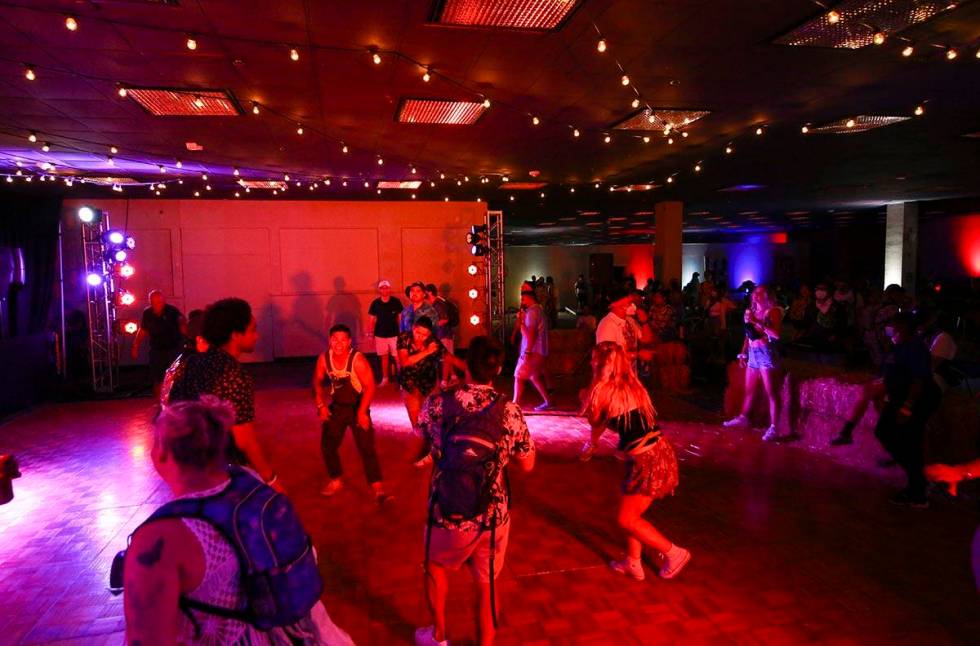 Attendees dance to music at the Western Country Club during the final day of the Life is Beauti ...