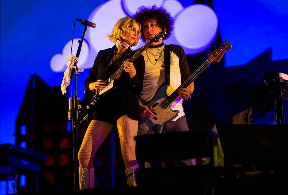 St. Vincent, left, performs with her band at the downtown stage during the final day of the Lif ...