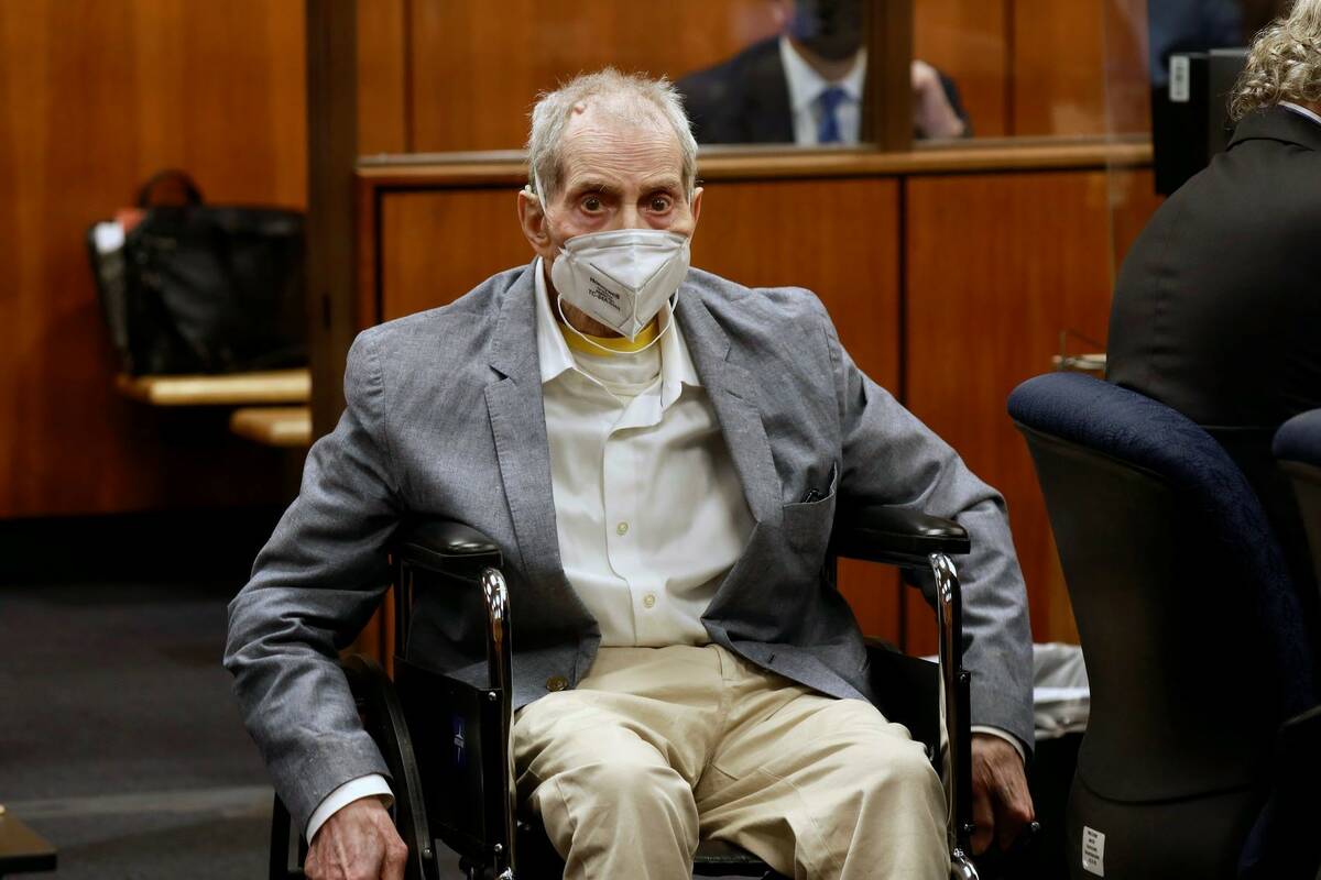 Robert Durst in his wheelchair spins in place as he looks at people in the courtroom during his ...