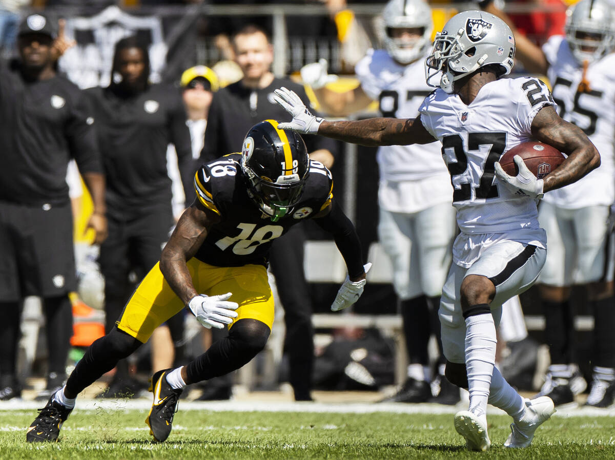 Raiders cornerback Trayvon Mullen (27) runs back an interception against Pittsburgh Steelers wi ...