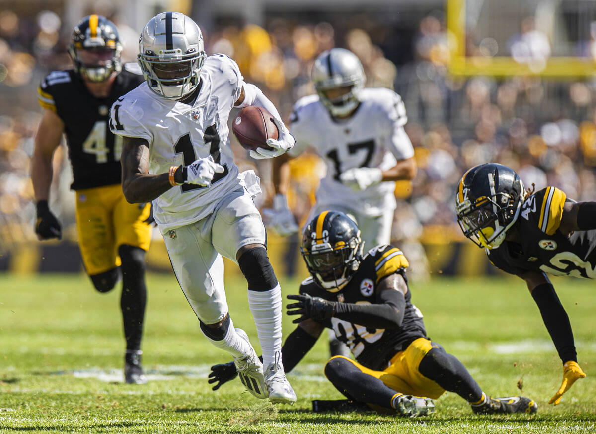 Raiders wide receiver Henry Ruggs III (11) breaks a big run past Pittsburgh Steelers cornerback ...