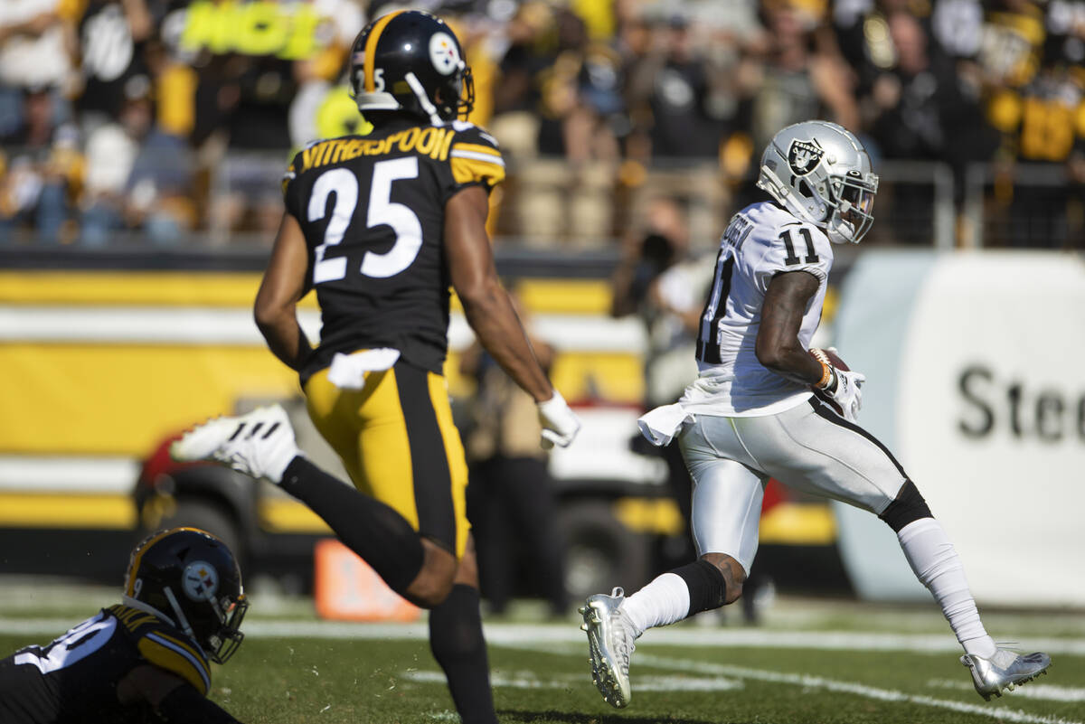 Raiders wide receiver Henry Ruggs III (11) catches a touchdown past Pittsburgh Steelers cornerb ...