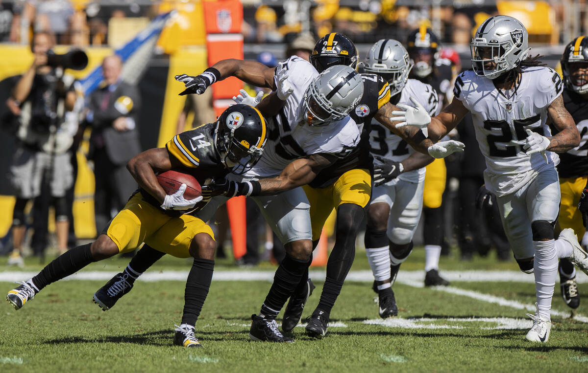 Raiders linebacker Javin White (53) tackles Pittsburgh Steelers wide receiver Ray-Ray McCloud ( ...