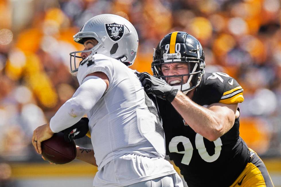 Raiders quarterback Derek Carr (4) is sacked by Pittsburgh Steelers outside linebacker T.J. Wat ...