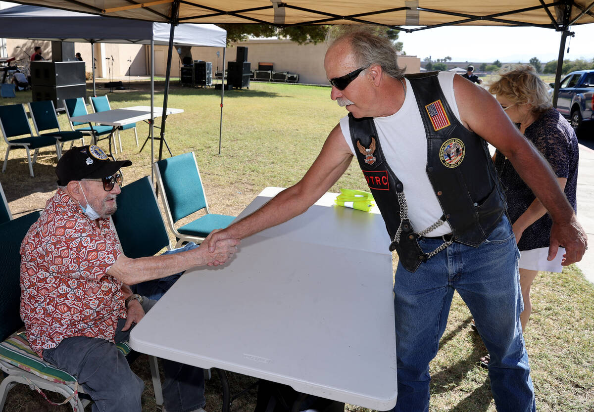 World War II veteran Vincent Shank, left, is honored by Dave Christian on his 105th birthday at ...