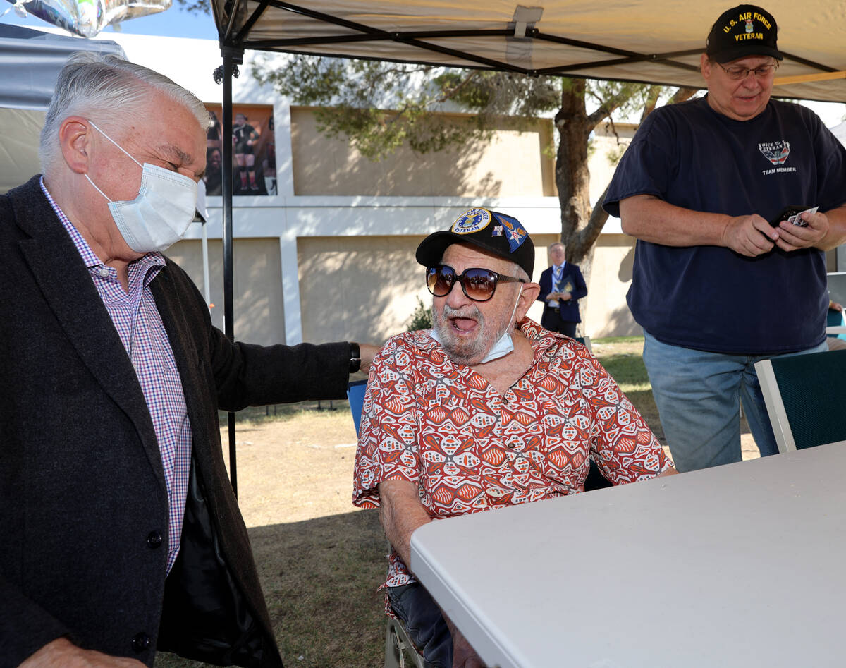 World War II veteran Vincent Shank, right, is honored by Gov. Steve Sisolak on his 105th birthd ...