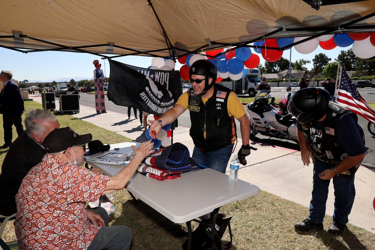 World War II veteran Vincent Shank, right, is honored by motorcyclists his 105th birthday at Ch ...