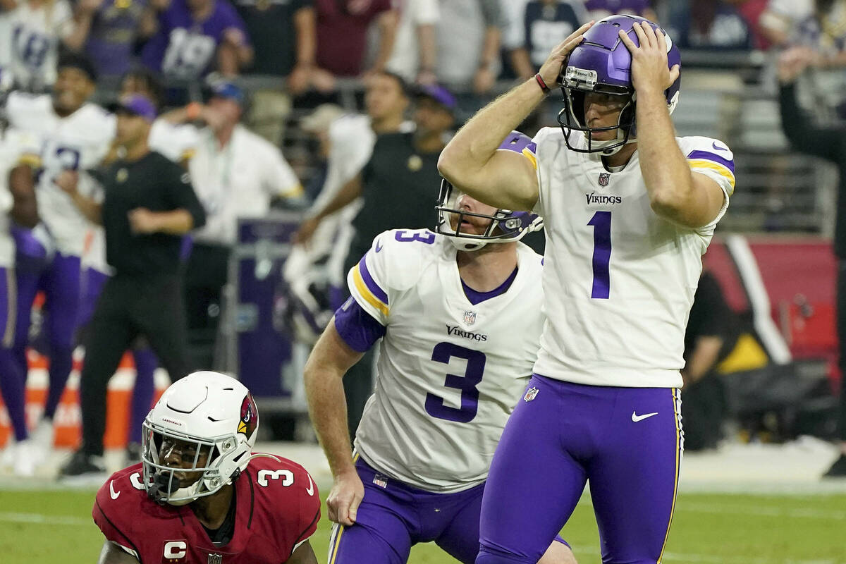 Minnesota Vikings kicker Greg Joseph reacts to missing a last second field goal as teammate Jor ...
