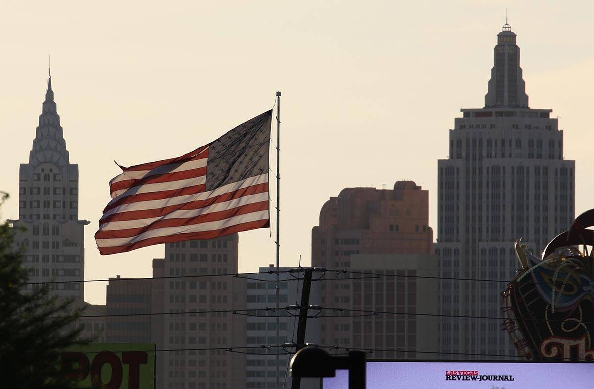 New York New York is seen as a large American flag blows in the wind during a windy morning on ...