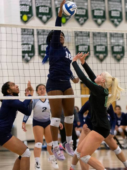 Shadow Ridge's Jocelyn Sanders (16) attempts a kill while Palo Verde's Rilee Read (15) rushes t ...