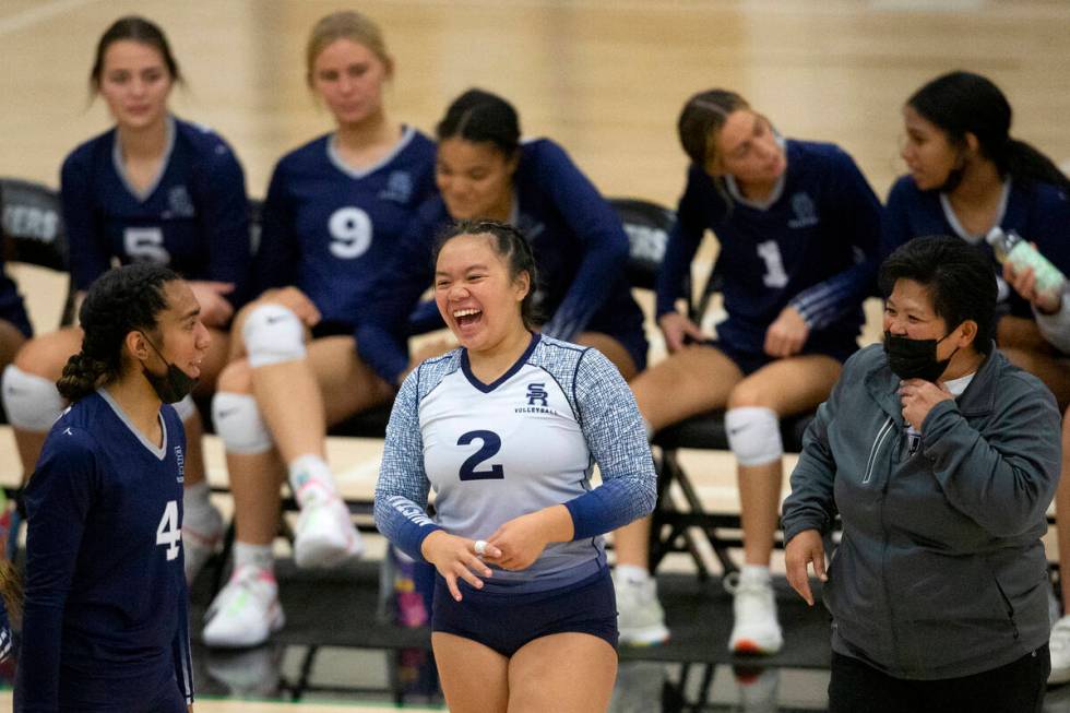 Shadow Ridge's Moni Jerome (4), Lali Makaiwi (2) and head coach Jo Makaiwi laugh during their h ...