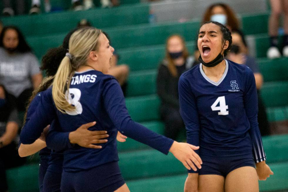 Shadow Ridge's Kylie Boyd (8) and Moni Jerome (4) celebrate a kill by their team during their h ...