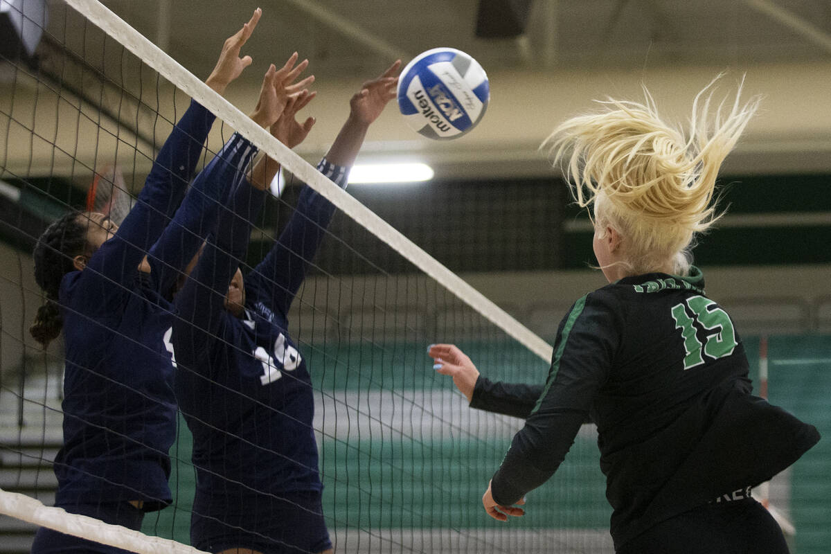 Shadow Ridge's Moni Jerome (4) and Jocelyn Sanders (16) kill a shot by Palo Verde's Rilee Read ...