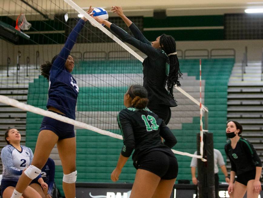 Palo Verde's Naomi White (8) kills a shot by Shadow Ridge's Jyniah Sanders (14) during their hi ...