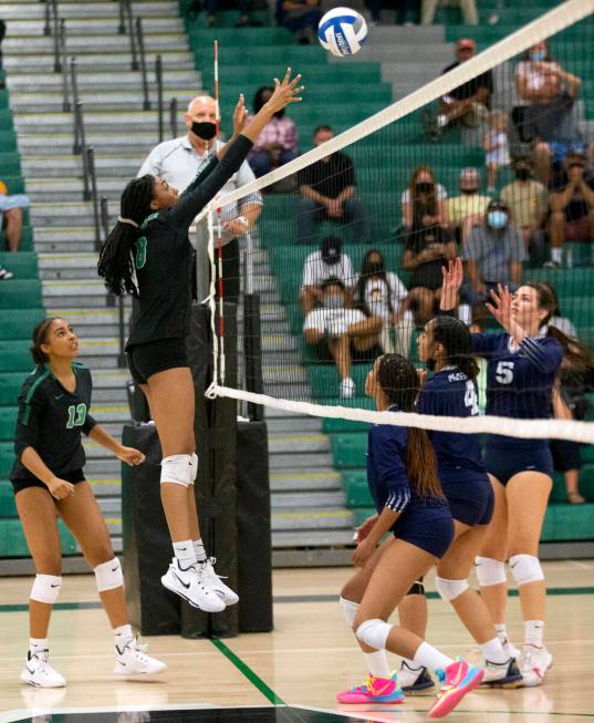 Palo Verde's Naomi White (8) sets over to Shadow Ridge while her teammate Dani Robinson (13) lo ...