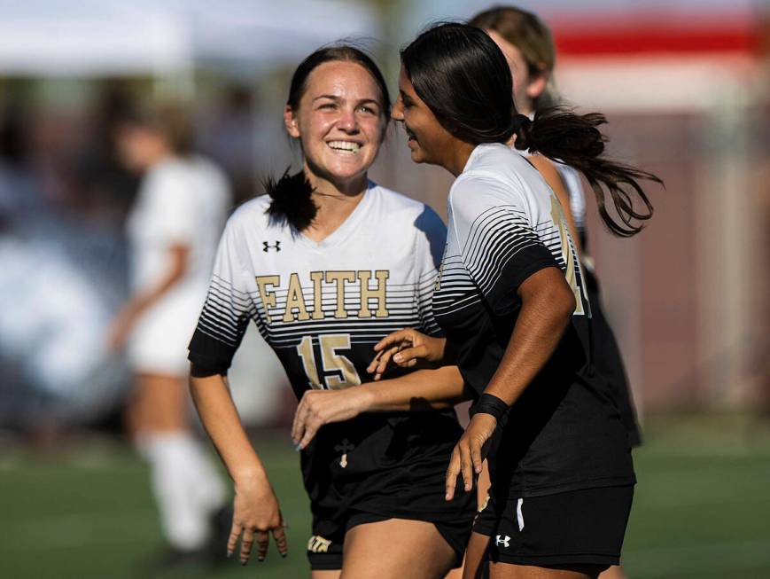 Faith Lutheran’s Serene Gronauer (15) and Andrea Leyva (10) celebrate a goal during a gi ...