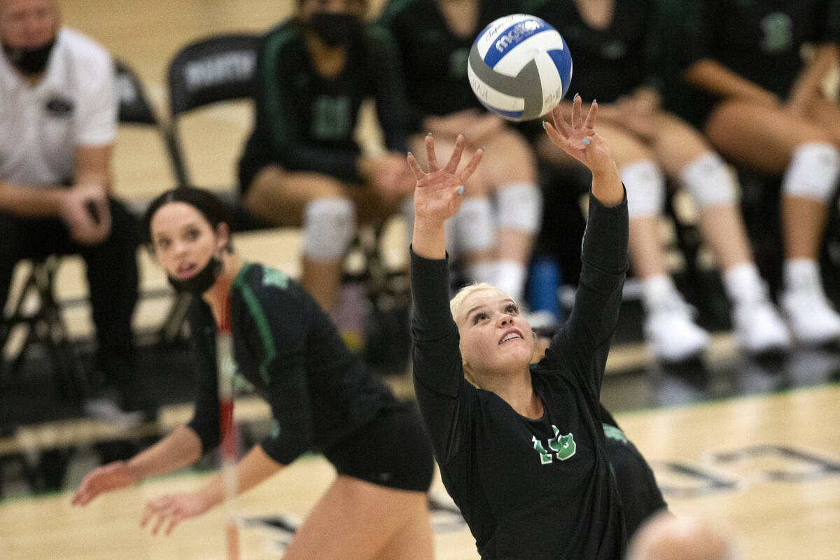 Palo Verde's Rilee Read (15) sets as her teammate Emma Neville (6) runs up behind to spike duri ...