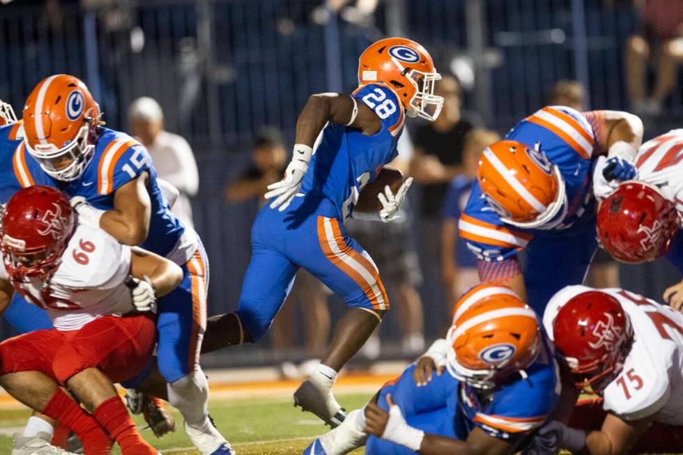 Bishop Gorman's Devon Rice (28) runs the ball for a touchdown against Arbor View during the fir ...