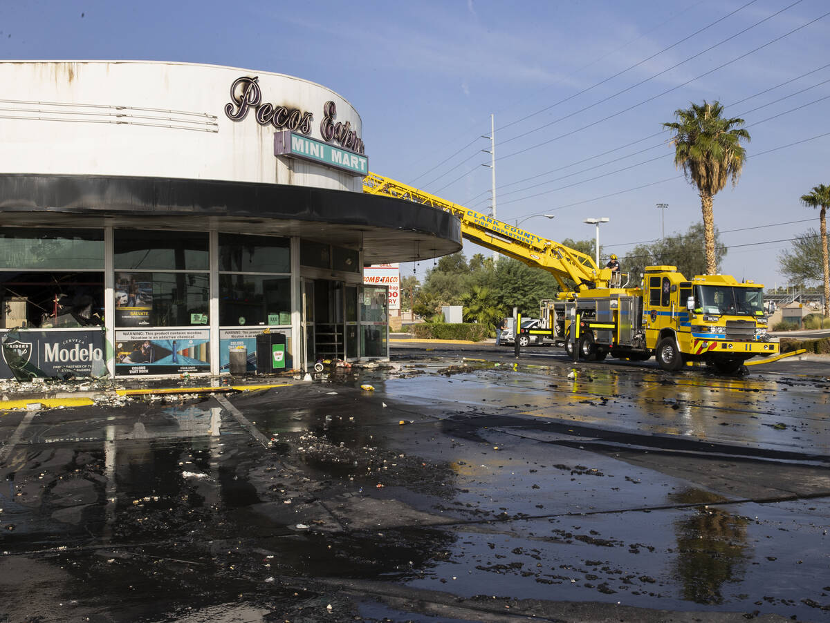 Clark County firefighters on the scene of a fire that damaged Pecos Express convenience store o ...