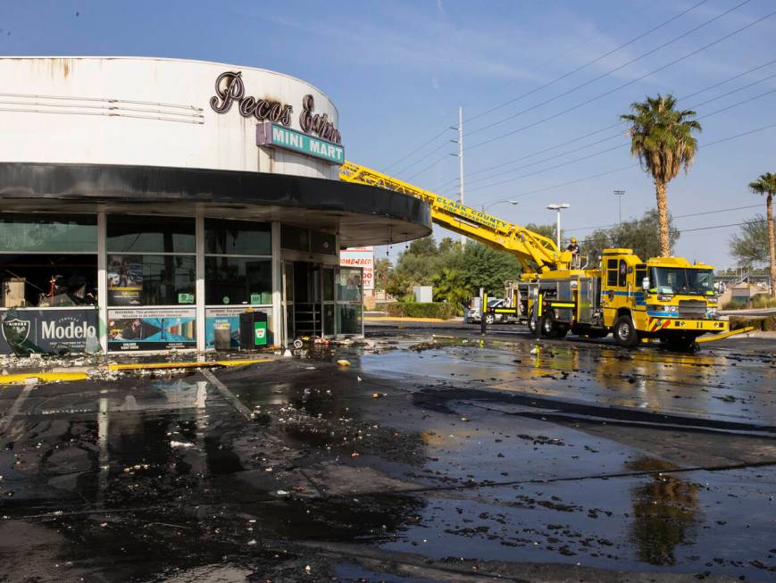 Clark County firefighters on the scene of a fire that damaged Pecos Express convenience store o ...