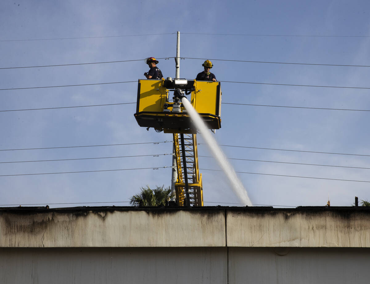 Clark County firefighters on the scene of a fire that damaged Pecos Express convenience store o ...