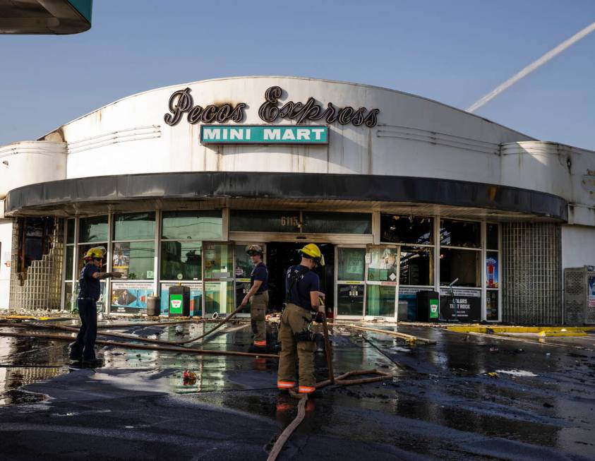 Clark County firefighters on the scene of a fire that damaged Pecos Express convenience store o ...