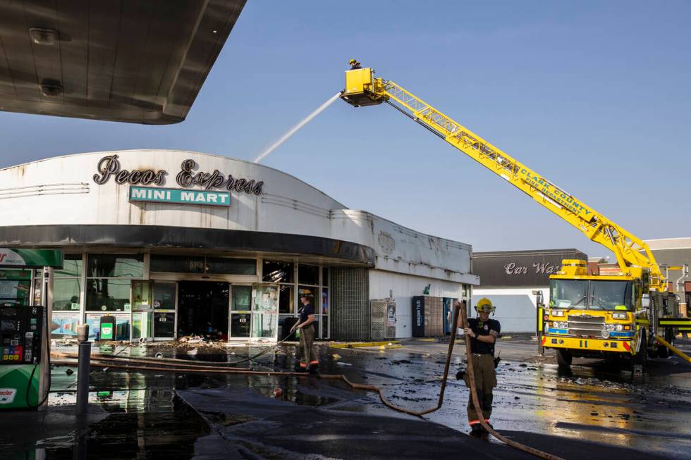 Clark County firefighters on the scene of a fire that damaged Pecos Express convenience store o ...