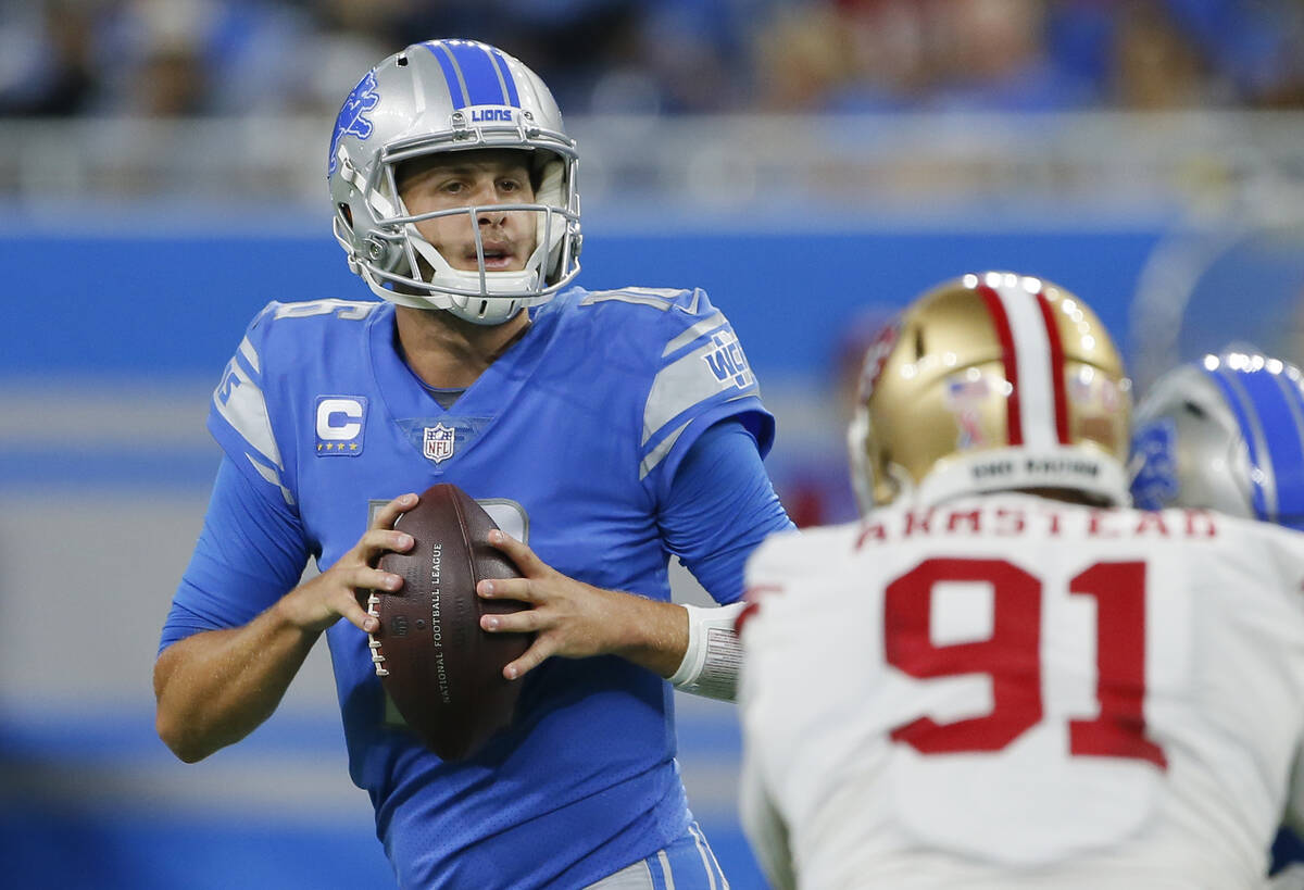 Detroit Lions quarterback Jared Goff (16) looks to pass against San Francisco 49ers defensive e ...