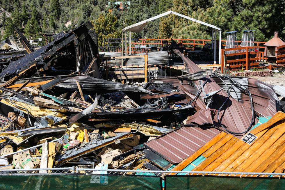 Debris of the former Mount Charleston Lodge is fenced off on Monday, Sept. 20, 2021. (Rachel As ...