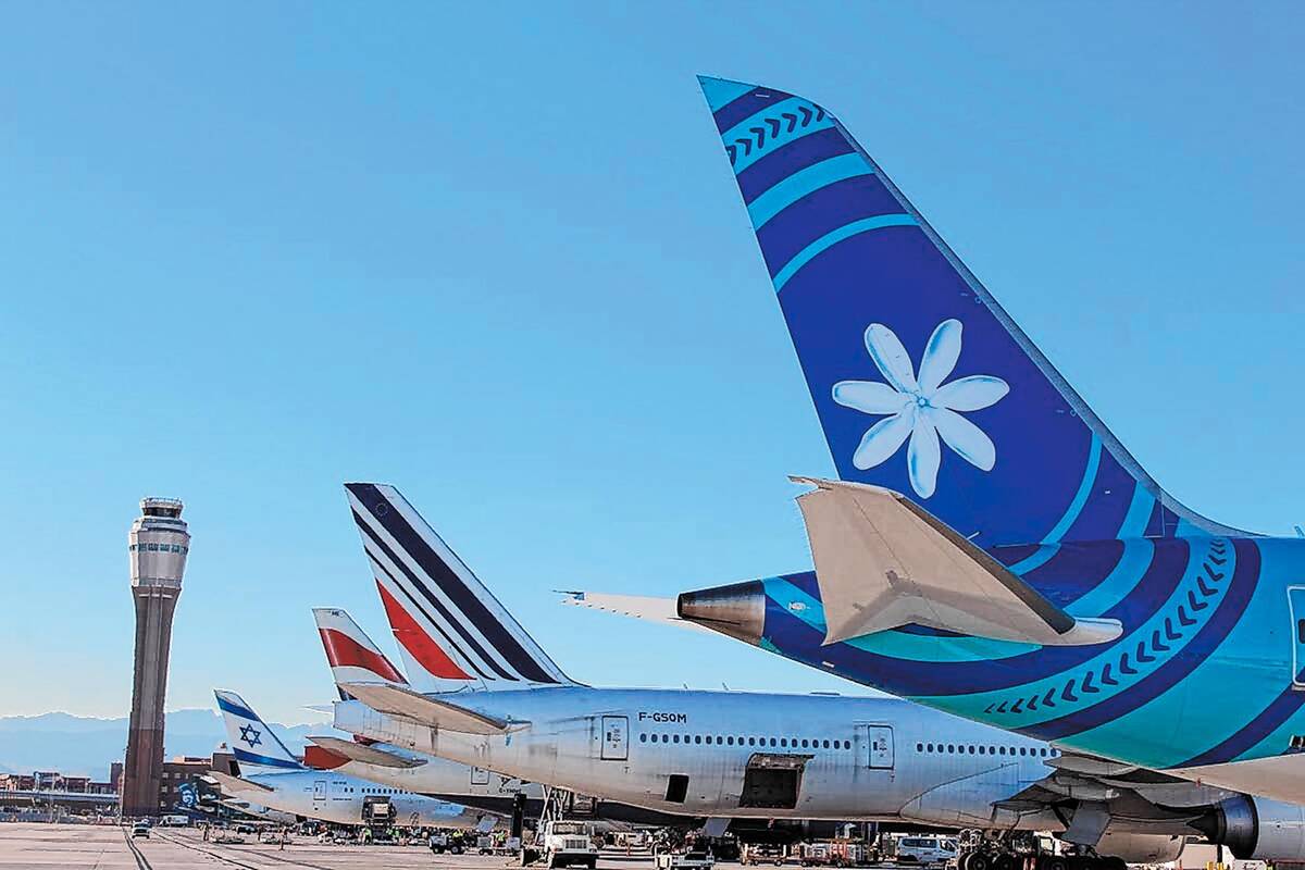 The tails of several international air carriers on Monday, Jan. 6, 2020, as extra flights arriv ...