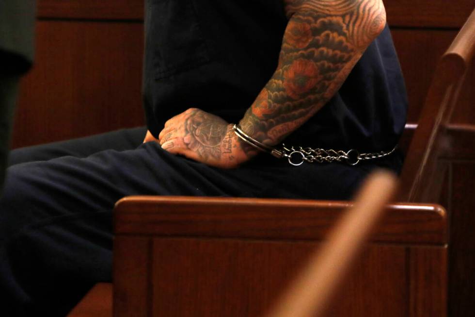 Handcuffed New Haven police officer Robert Ferraro sits in the courtroom for his court hearing, ...