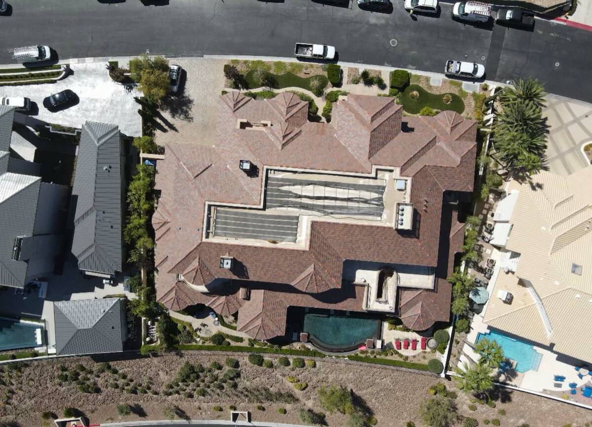 A drone image from early June 2021 shows solar panels in disrepair atop the home of Las Vegas i ...