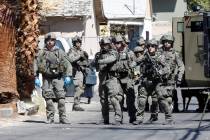 A heavy police presence is visible around a house in the 300 block of South 11th Street, Tuesda ...