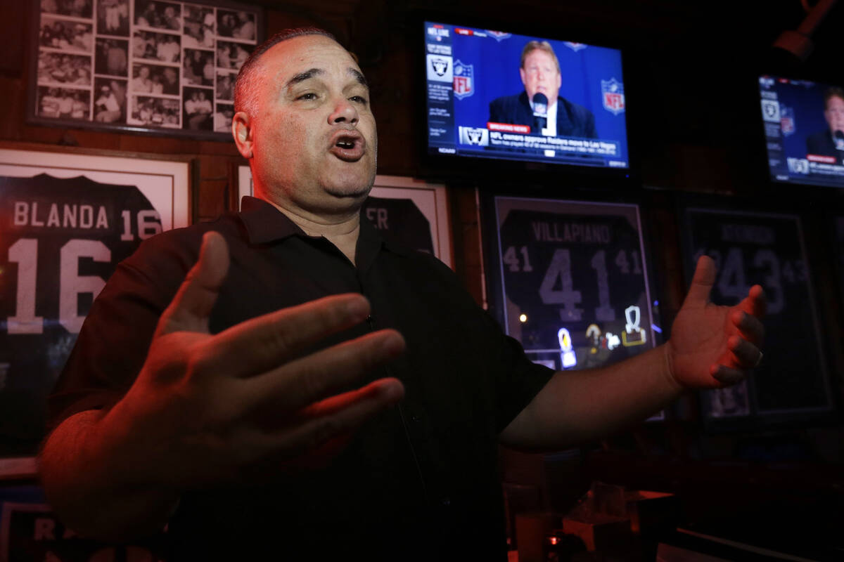 Rob Rivera, president of the Black Hole fan club, gestures while answering questions from a rep ...